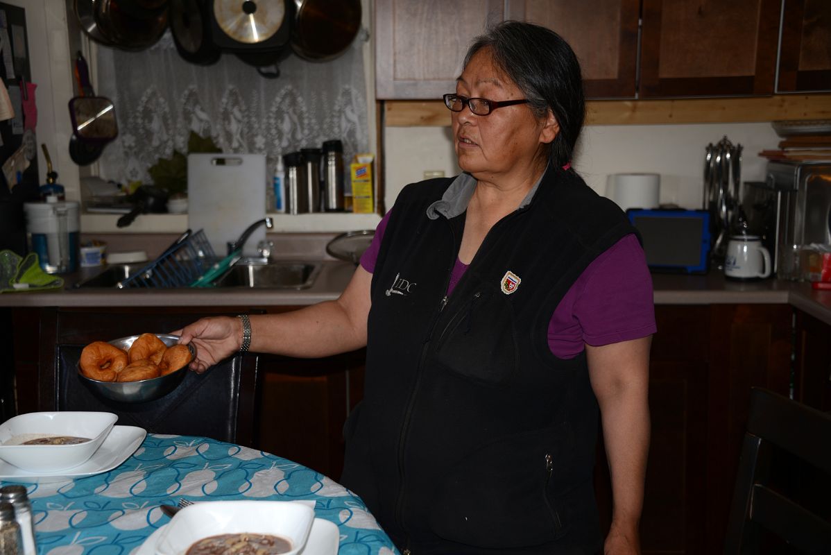 09C Local Guide Eileen Jacobson Passing Us Arctic Donuts In Her Kitchen On Arctic Ocean Tuk Tour In Tuktoyaktuk Northwest Territories
